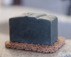 Activated Bamboo Charcoal Goat Milk Soap in a soap dish