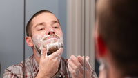 Fletcher lathering Goat Milk Soap foam onto his face