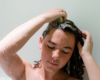 Indigo using shampoo bar on her hair