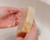 Goat Milk bar lathered up washing hands in a sink