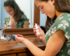 woman using a Goat Milk Stuff perfume