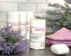 four tubes of Lavender Deodorant with lavender flowers