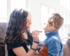 Indigo helping Landon put on lip balm