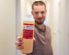 Colter holding a goat milk soap refill