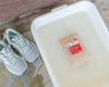 goat milk bath in small tub of water