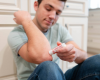 Applying small lotion stick on elbows