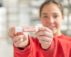 Jade holding Small Goat Milk Lotion stick