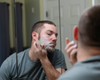 Fletcher using goat milk soap on his face