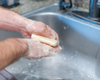 Washing hands using goat milk soap
