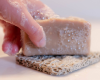 placing bar of goat milk soap on Soap Rest