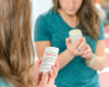 Woman reading the label of the Goat Milk Deodorant
