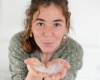 Indigo with goat milk liquid soap in her hands