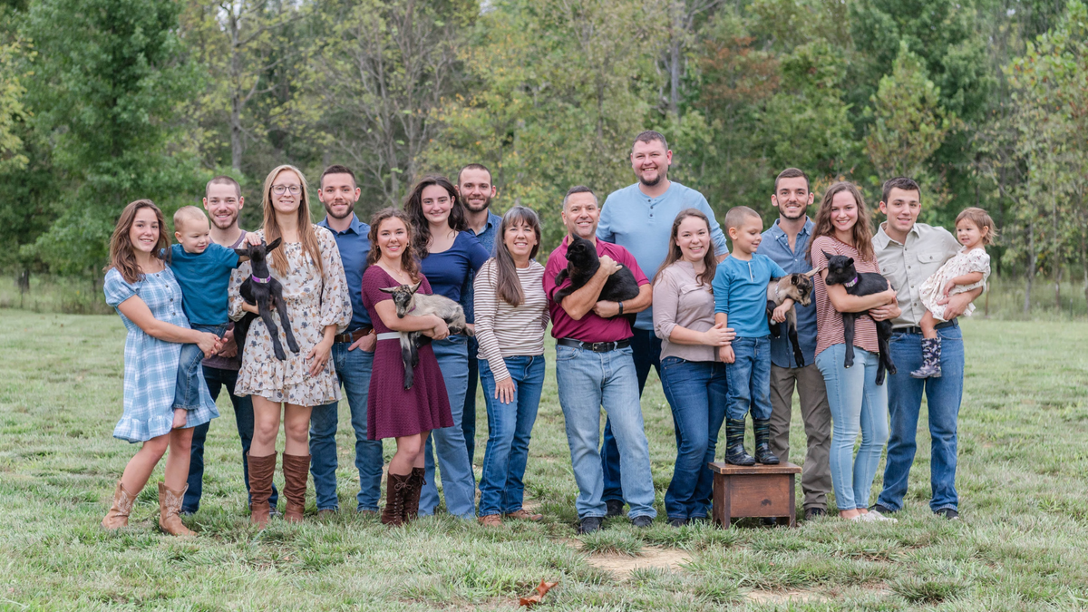 Jonas family with goats and Jason the cat