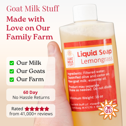 Bottle of liquid soap with a label indicating it's made with goat milk on a beige background.