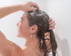 Jade washing her hair with goat milk shampoo bar