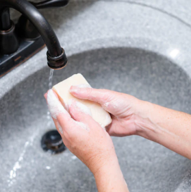 Washing hands in the sink with the Goat Milk Soap