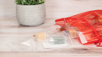 Gift pack contents displayed beside a potted plant