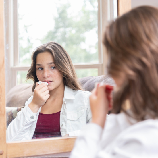 Jade applying goat milk lip balm