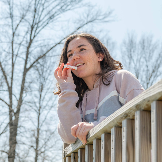 Indigo applying goat milk lip balm
