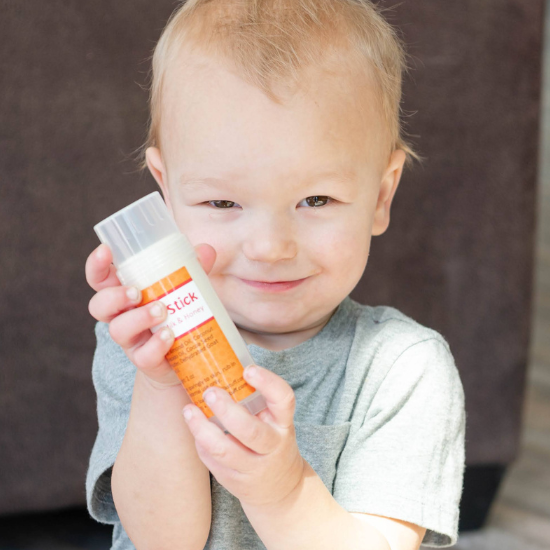 MIchael hold large solid goat milk lotion stick
