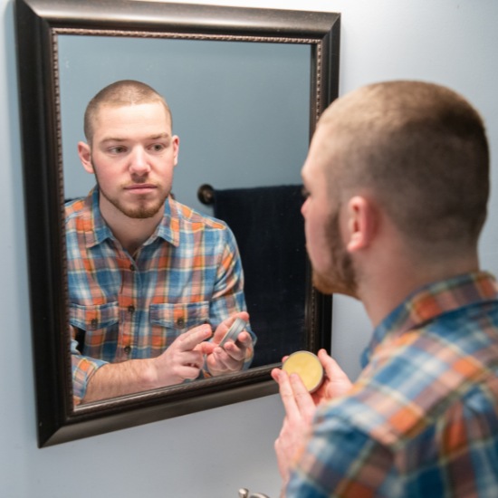 Fletcher applying beard balm 