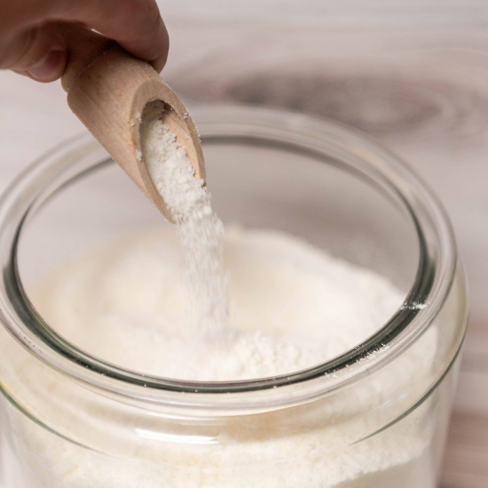 wood scoop of goat milk laundry soap 