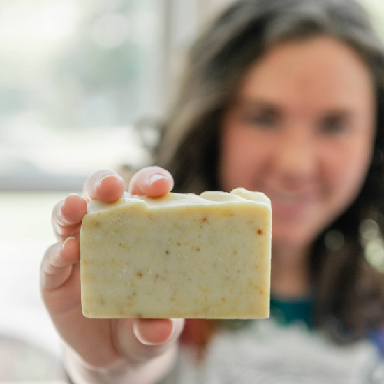 Indigo holding the Calendula Goat Milk Soap