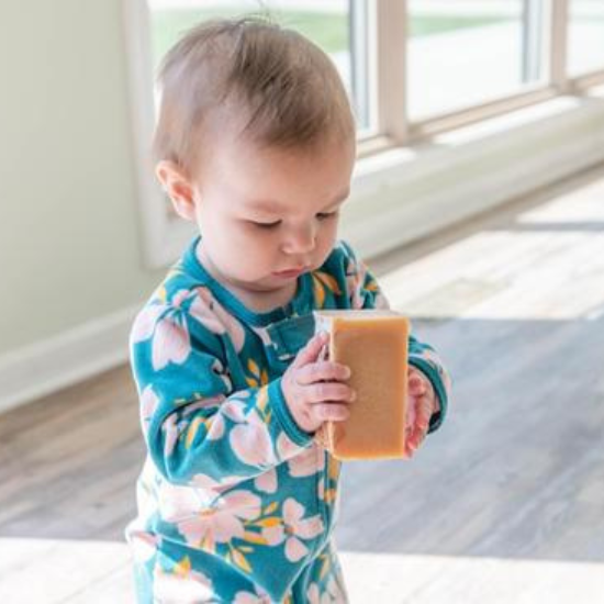 Baby holding a Goat Milk Soap