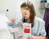 Jade scooping Goat Milk Laundry Soap into washing machine