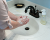 Washing hands using liquid goat milk soap