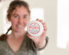 Indigo holding a lotion tub