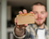 Fletcher holding a goat milk soap bar