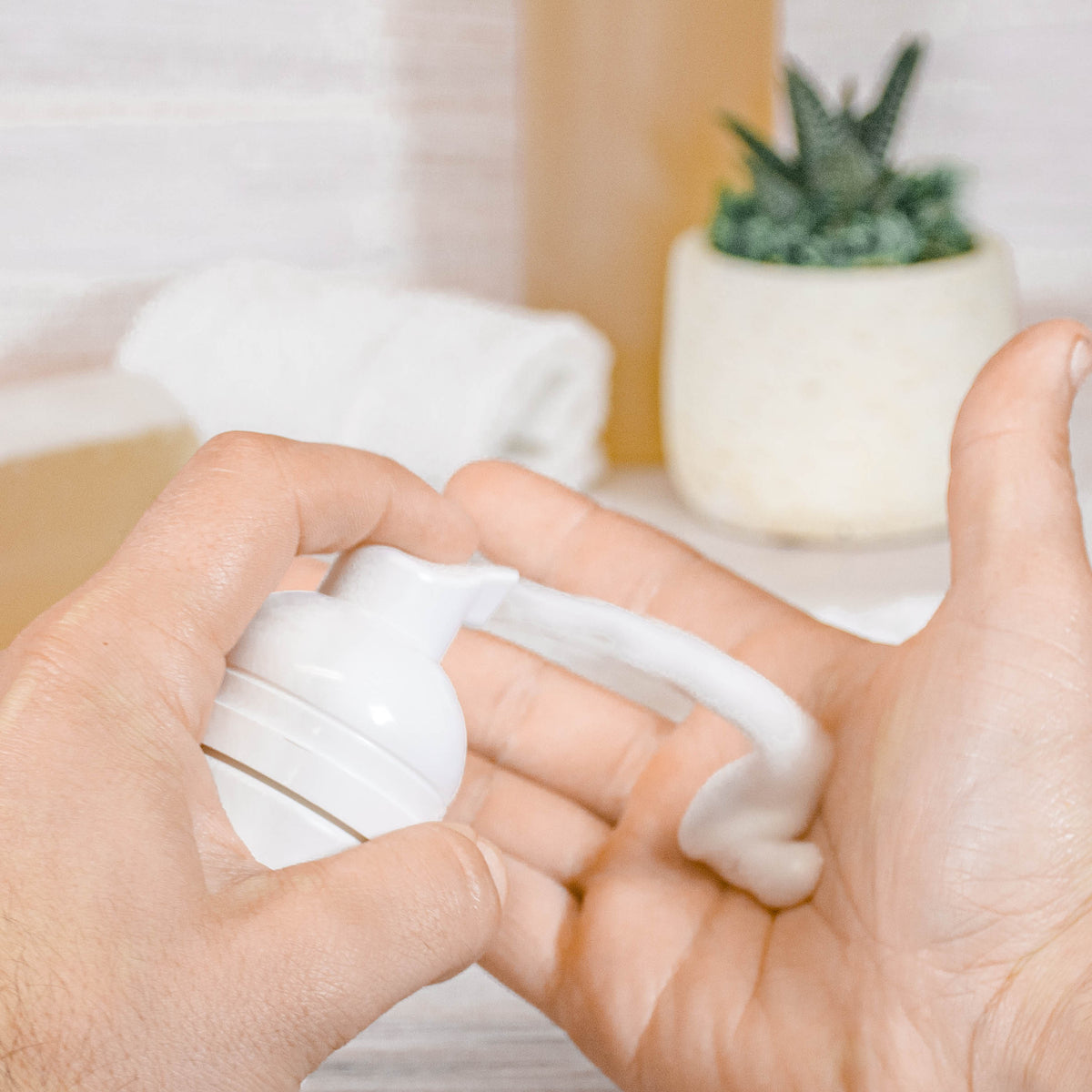 goat milk liquid soap foam in hands